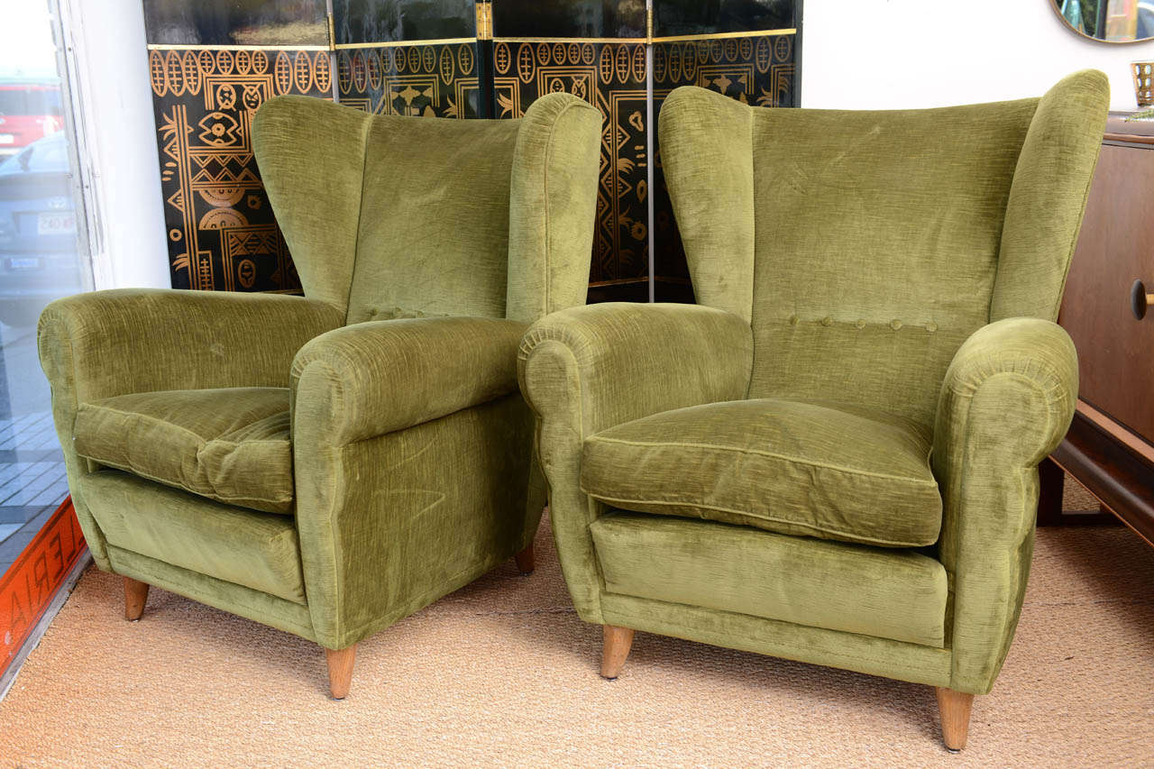 Very comfortable pair of dark green arm chairs. Fabric is in excellent condition.