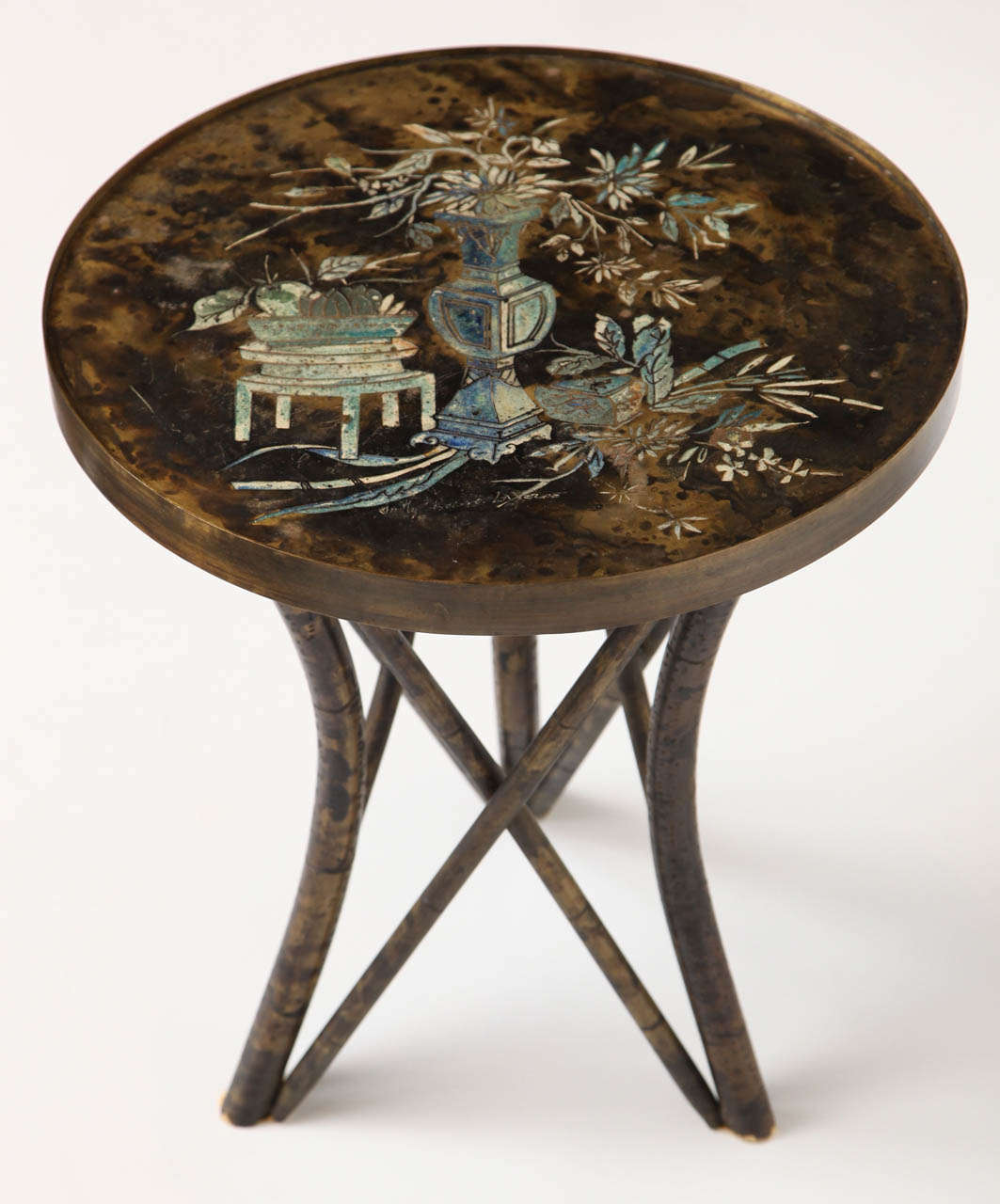 Patinated bronze side table by Philip and Kelvin LaVerne, with acid-etched relief motifs on the tabletop.

Signed 