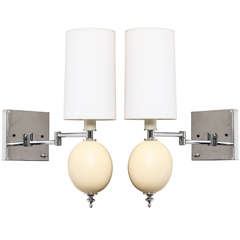 A Pair of 1970's Modernist Chrome and Ostrich Egg Wall Sconces