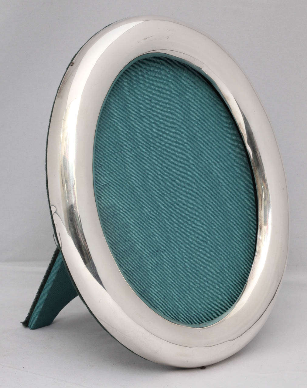 Sterling silver oval picture frame, Dominick & Haff, New York, circa 1900. Measures: 8