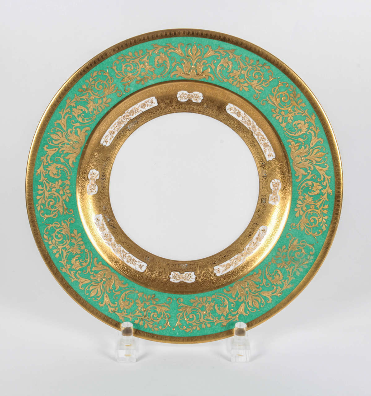 Crown Staffordshire green powder finish, presentation plates with raised gold gilt detailing. Cartouches of raised gilt design on inner collar.