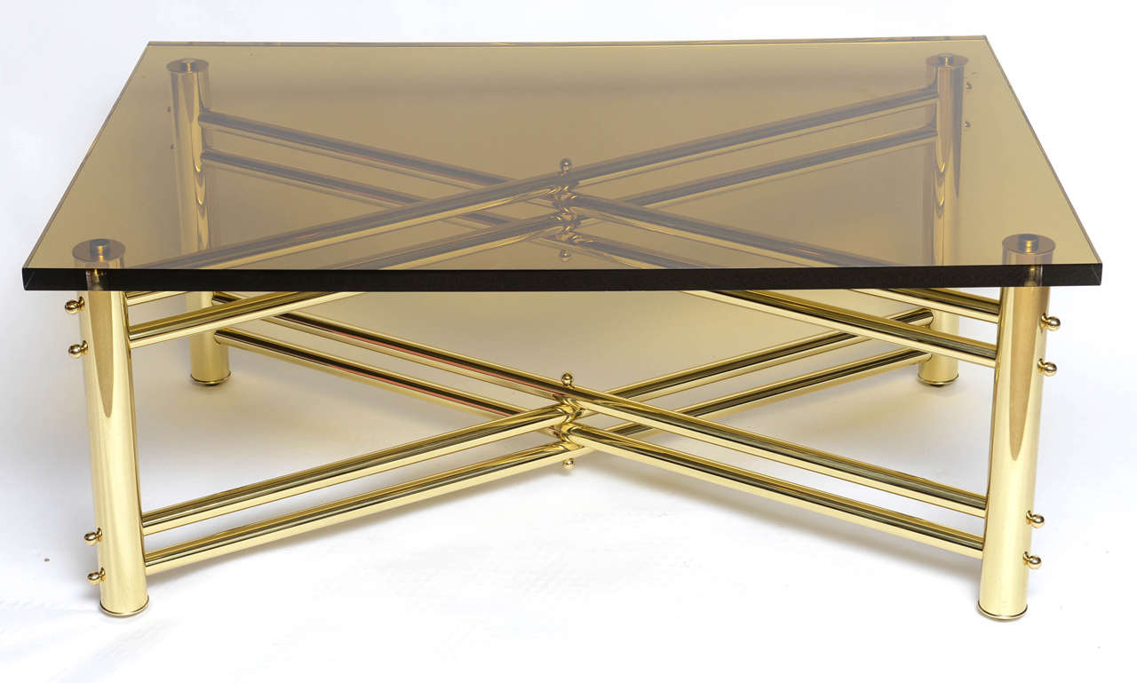 Polished brass base with lots of details, smoked thick acrylic top that truly accentuates the beauty of the 