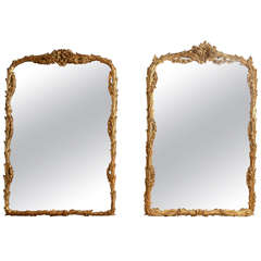 Unmatched Pair of Foliate Giltwood Mirrors
