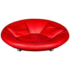 Sofa , 1980's, by De Sede, in red leather, with two cushins,