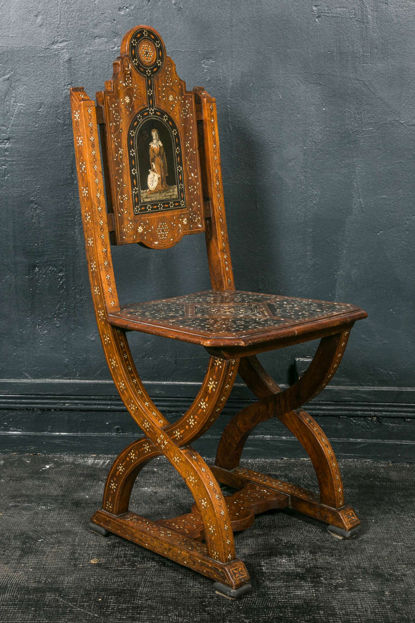 Pair of chairs , north Italy,one figuring a man ,and the other a woman ,plaked with ebony ,bone ,lemon tree,pwuter,mahogany,copper,mother of the pearl,Pogliano work art ,beginning of nineteenth century,in the taste of Orientalism