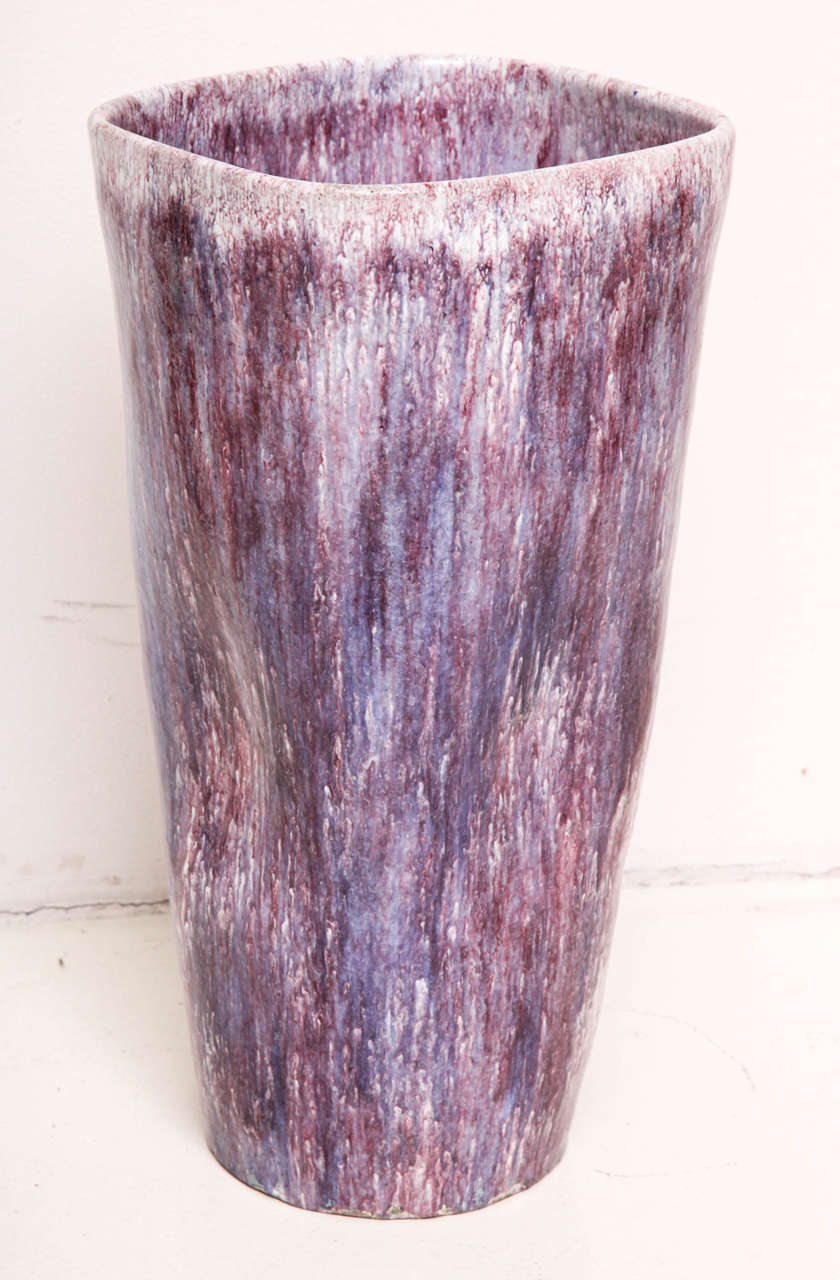 Marcello Fantoni (b. 1915)
Tall ceramic vase with a rounded square shape and slightly concave sides. The interior and exterior are glazed with various shades and layers of purple over a white ground.
Signed.
Italian, circa 1940.