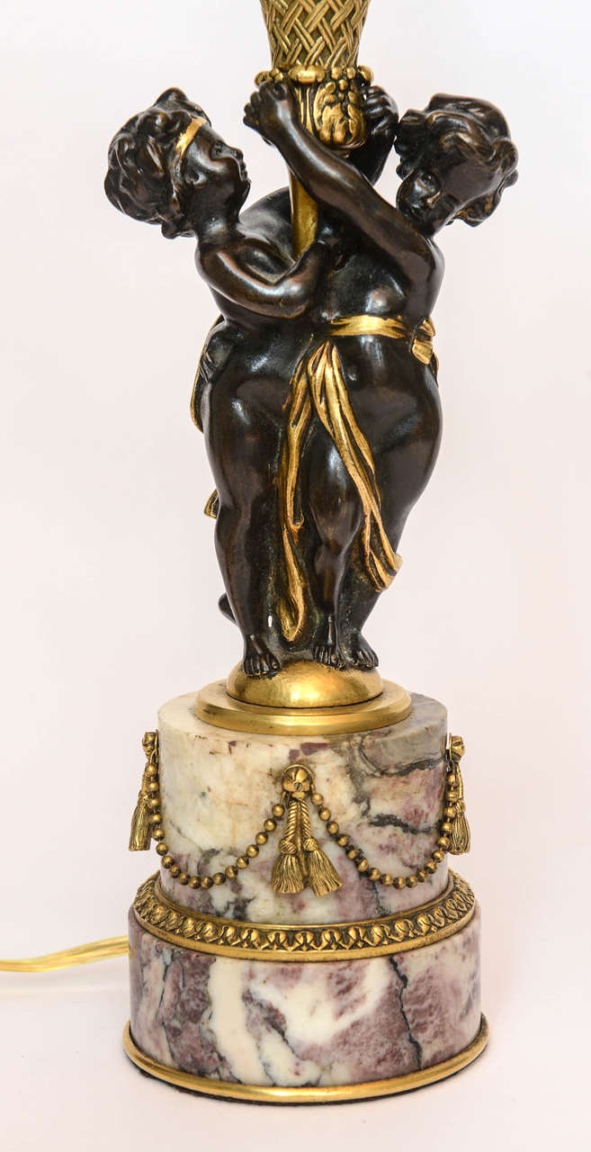 American Pair of Children Holding Candelabra Mounted on Rouge Marble by E.F. Caldwell For Sale