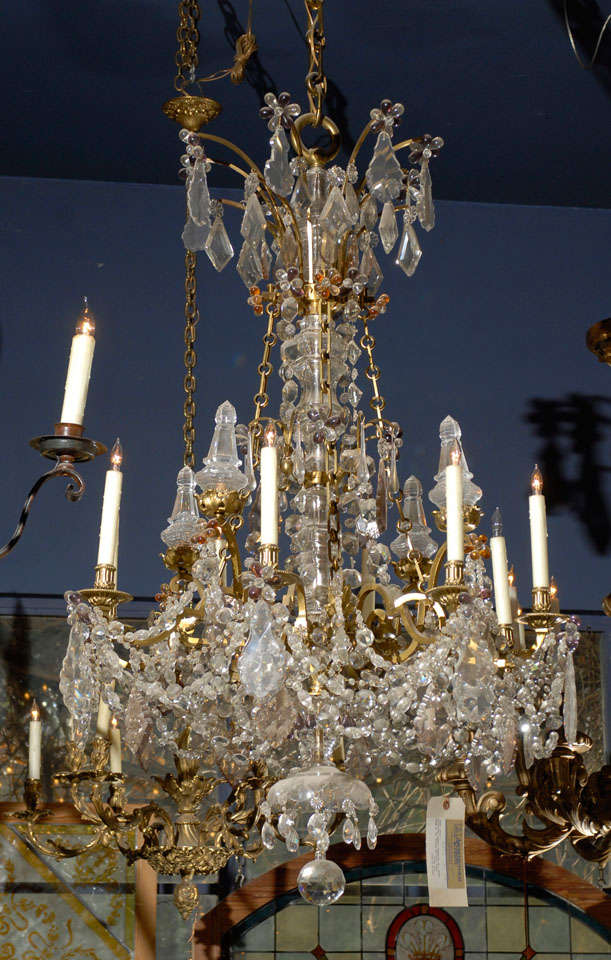 Rare and exceptional 19th Century French crystal and bronze chandelier as shown, complete and in excellent condition with 8 candles. The frame and crystals having been taken apart, restored re-wired and re-assembled.