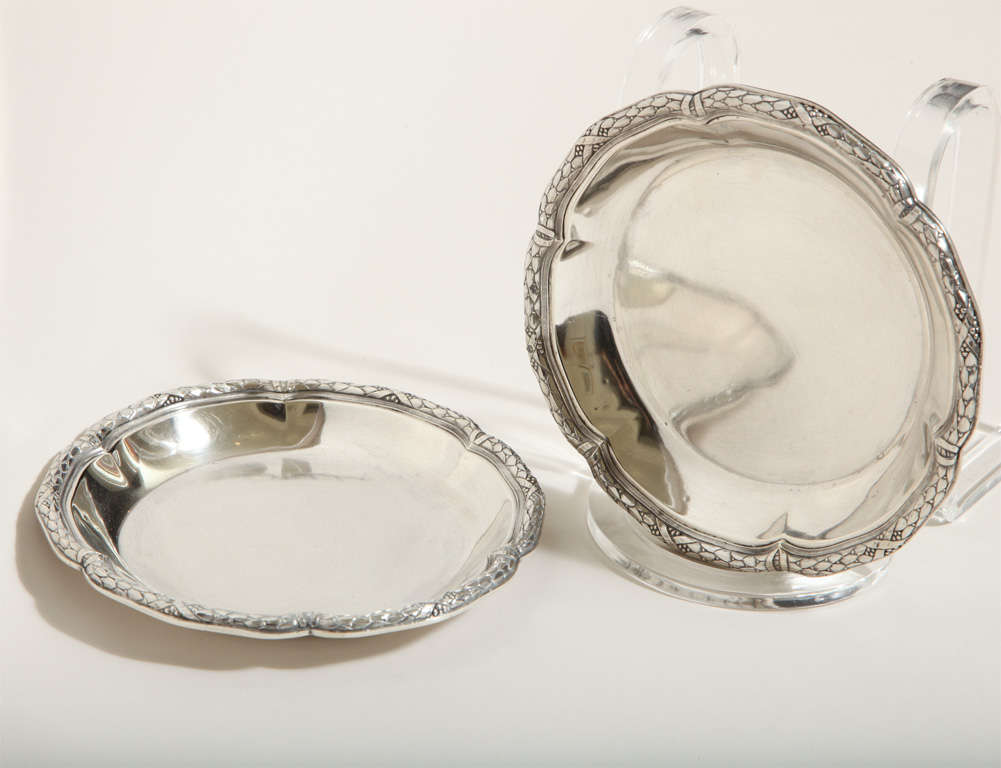 Magnificent heavy sterling silver wine coasters with beautiful detailed wavy border design by Amelie Cardeilhac (1904-1920), Paris. 

Hallmarks: for 950 silver/ Cardeilhac Paris/ Amelie Cardeilhac poincon.

Variety of other sterling silver pieces