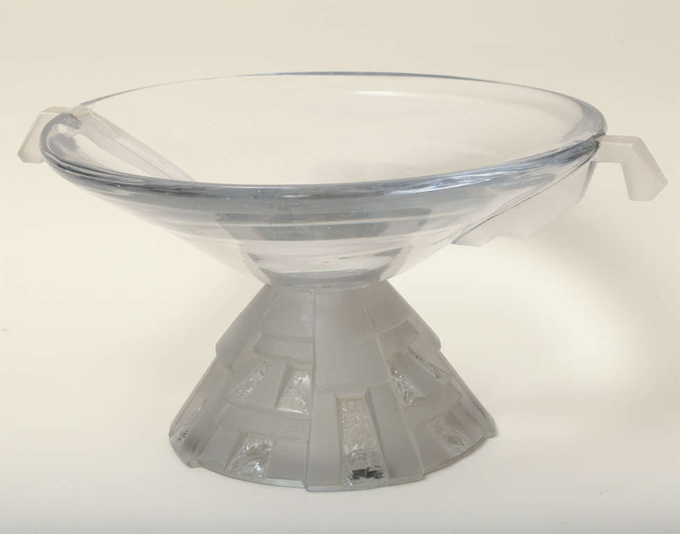 This grande coupe has two sand-blasted handles and rests on a conical  carved glass base.

Colotte was born in Baccarat and joined the Baccarat Glassworks when very young.  In 1919, he moved to Nancy and set up his studio there.  Working with large
