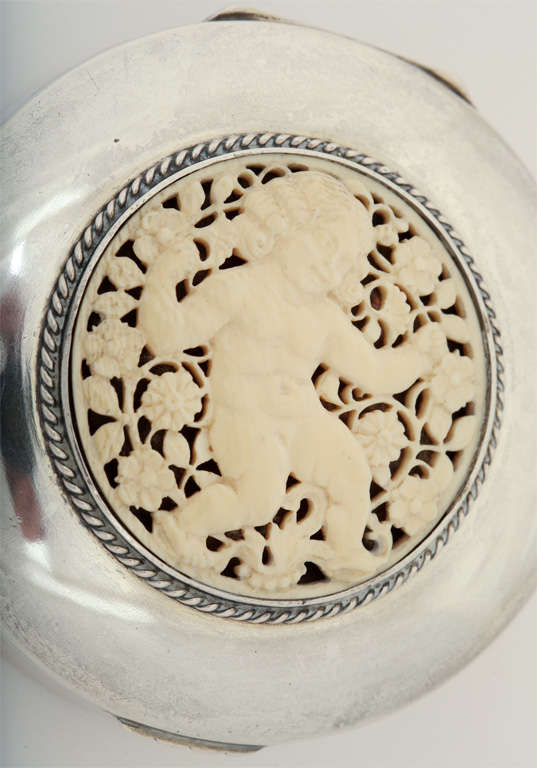Hinged silver box with a very finely carved ivory roundel of a small child surrounded by flowers by Koch & Bergfeld, Bremen, Germany.
Hallmarks:  for 800 silver/ German Crown & Half Moon/ Koch & Bergfeld poincon

*Variety of other silver boxes