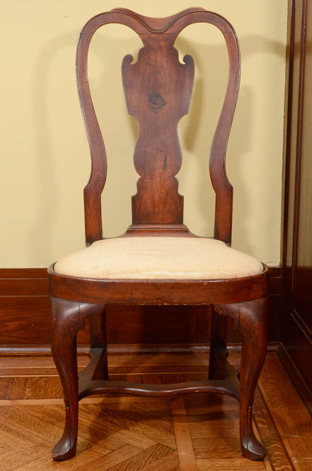A Rare Queen Anne Walnut Compass-Seat Side Chair  
Philadelphia, c. 1750

The chair marked IV and original seat frame marked V.
Height 40 inches.

PROVENANCE:
Rear Admiral Edward P. Moore and Barbara Bingham Moore

This fine side chair is a