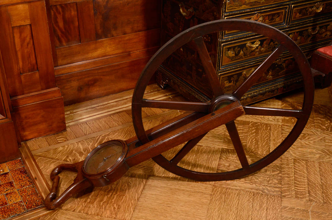 ALSO KNOWN AS A PERAMBULATOR, OR SURVEYOR’S WHEEL,
A WAYWISER is a mechanical wheel used to measure distance, often using a clock-like dial with measurements in yards, miles, furlong, poles, chains and links. Usually resembling a large wagon wheel,