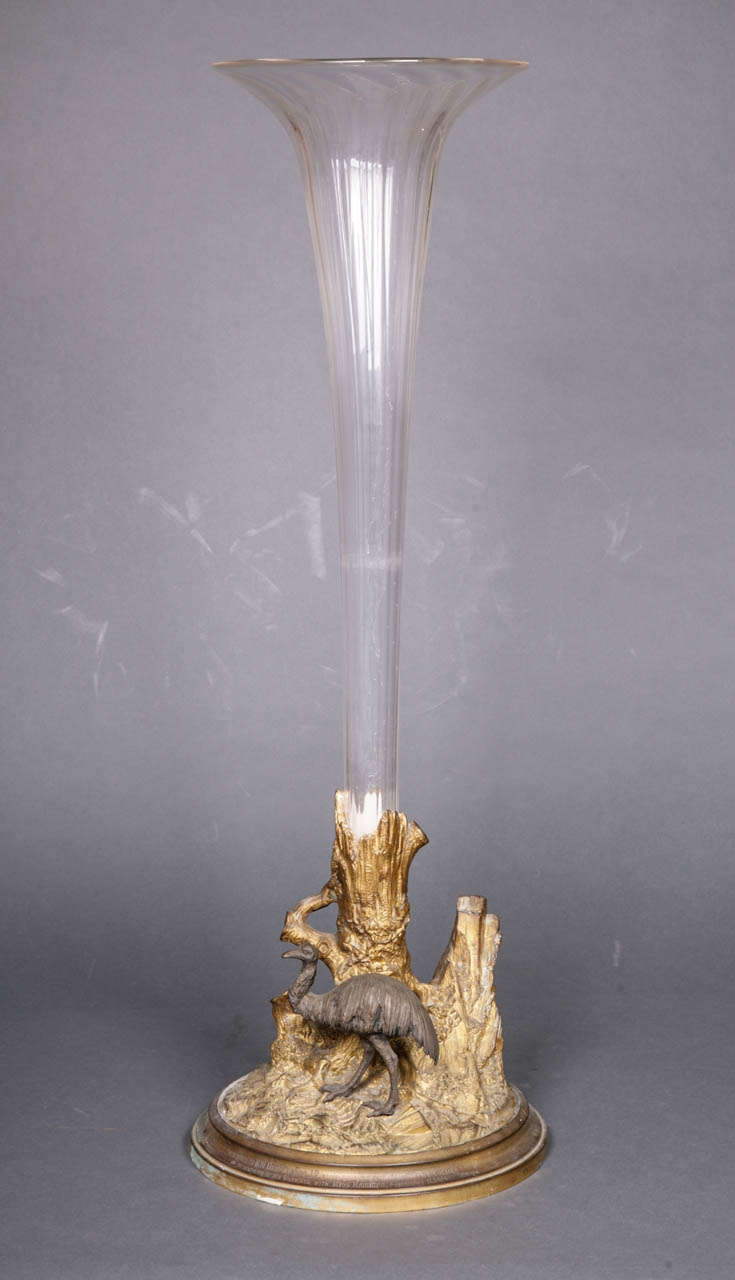 A hand-blown glass lily vase, supported on a gilt bronze base comprising a tree trunk and an emu on a naturalistic ground. Inscribed to the rim ‘Presented to R. W. Hanbury Esq. J. P. by the employes (sic) of the Coppice Colliery on the occasion of