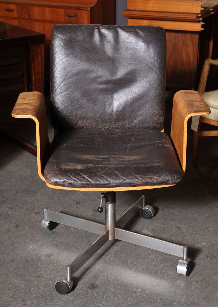 Vintage Danish Teak Desk/Task chair by Kevi.  Features steam bent teak frame, stainless steel base, castors, and original black leather upholstery.  Height Adjustable.