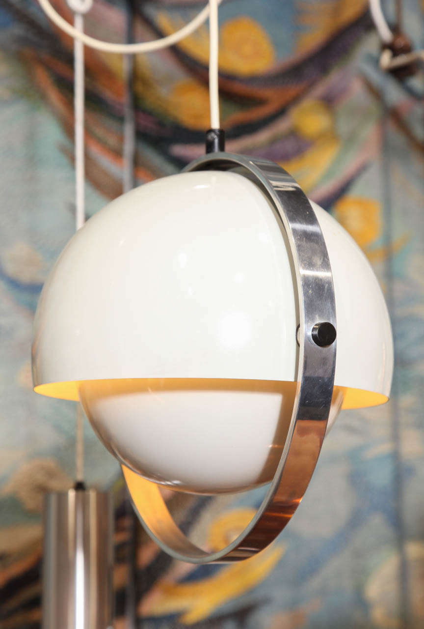 Sleek Danish Modern globe pendant in a glossy white finish.  Reminiscent of a Verner Panton Flowerpot Lamp.  Lower dome tilts open or closed. 11