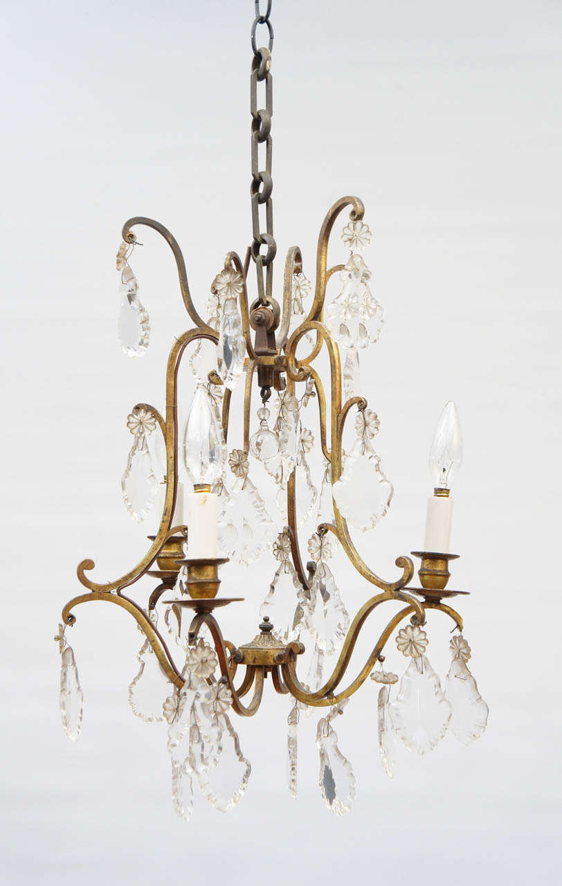 Three-light crystal chandelier electrified with USA wiring and flame bulbs. Terrific for an elegant bathroom, sitting room, breakfast room, entrance hall.  25