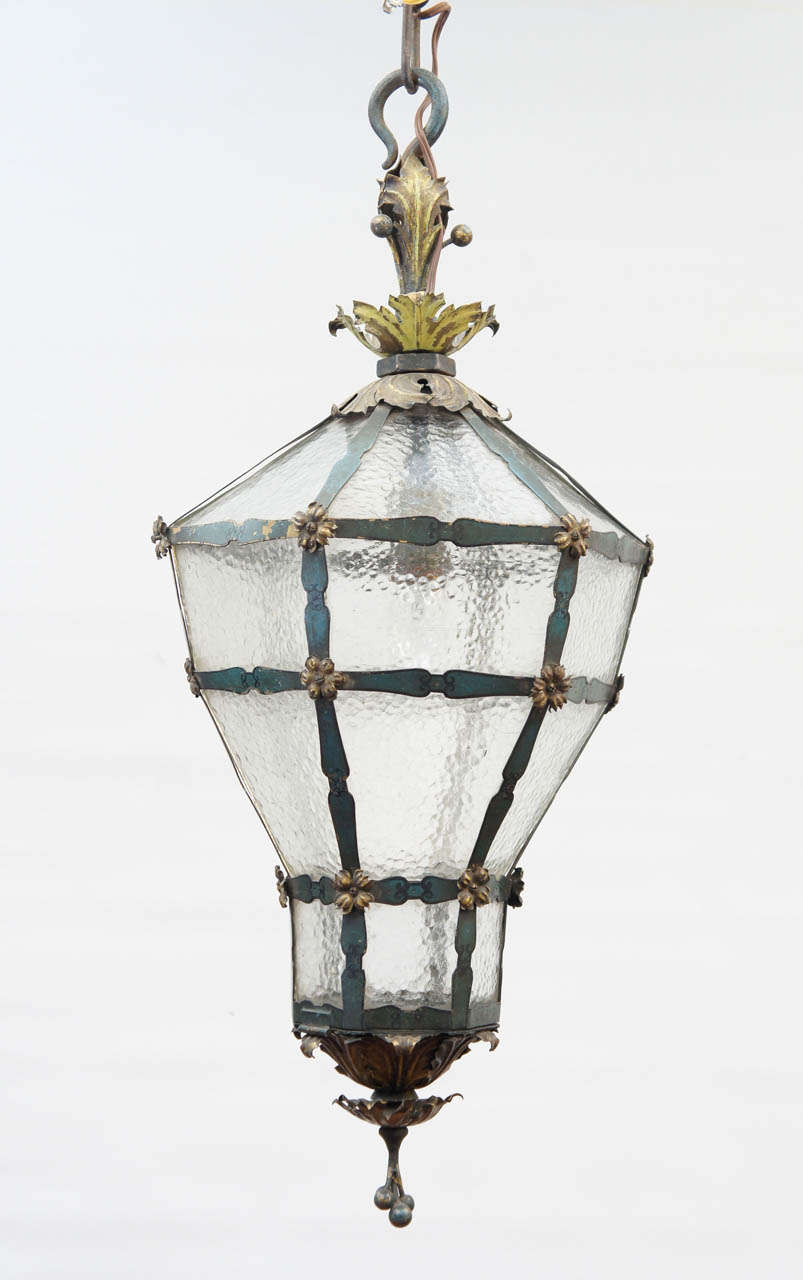 The details for great styling, tapered shape, mottled glass, blue-metal framing, gilt leaves and berries at top and bottom. Single light electrified for USA use. Can be used in neoclassical or classical setting. Be it a French antique look, a