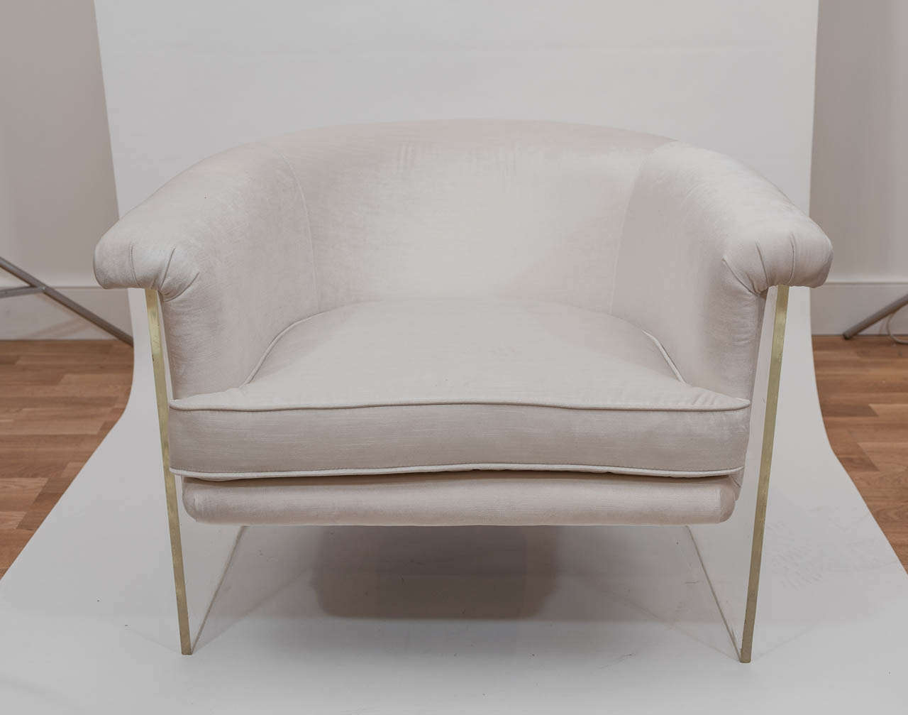 A chic and comfortable pair of retro tub chairs in new soft white upholstery with polished lucite bases!