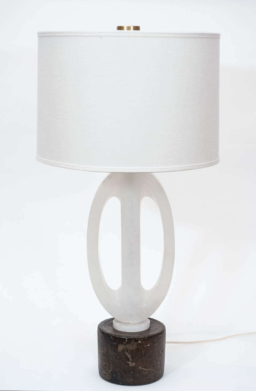 A lamp with a sculptural quality and complimentary 