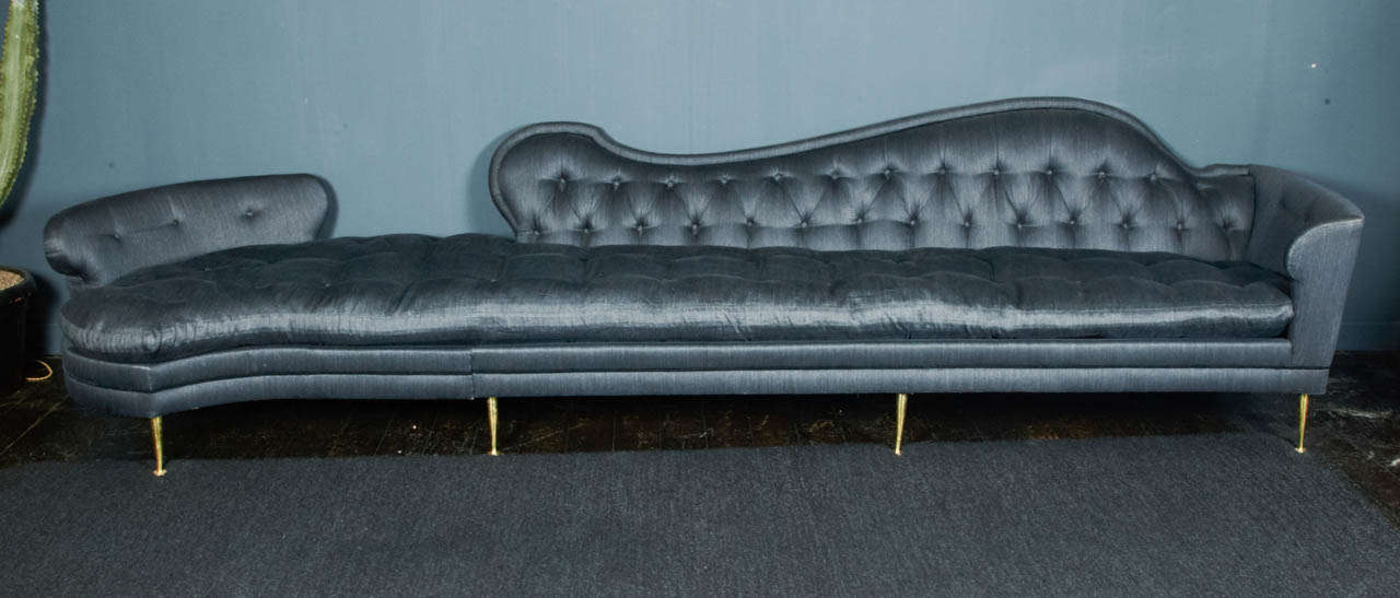 Amazing Oversized free shape upholstered sofa attributed to Dorothy Drapper who designed the same model for a Los Angeles house day bed (Dorothy Drapper book reference). This sofa was originally covered with a candy pink velvet and the wooden feet