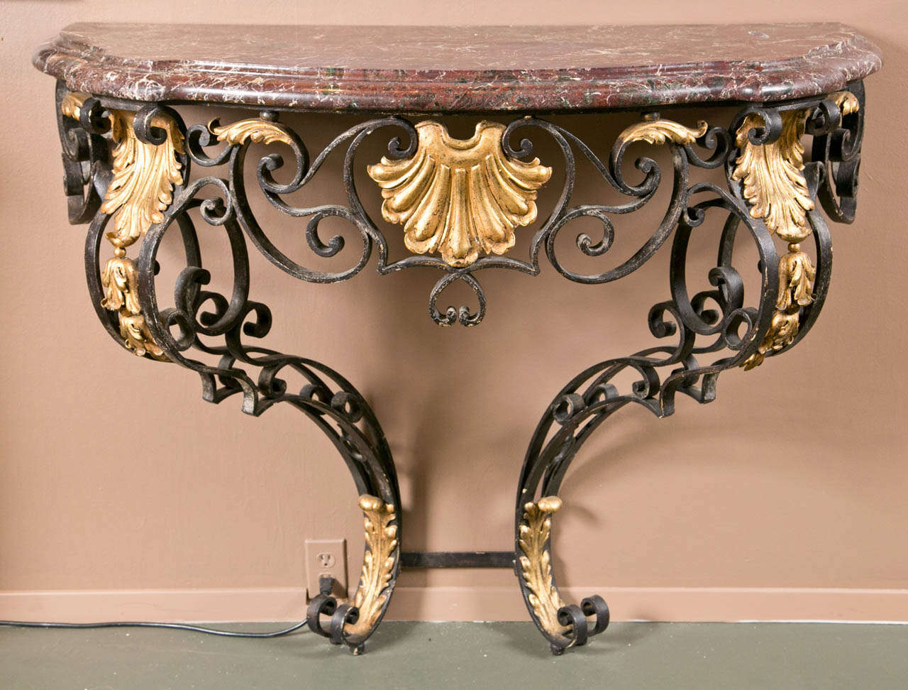 A French partially gilt wrought iron Regency console with an impressive rare purple rouge veiné - Breche d'Alep - marble top.
Elegant proportions and unusually stylish marble color for this perfectly sized console.

Provenance: Private chateau