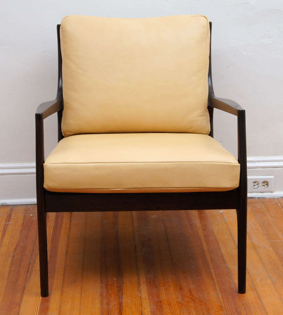 a wonderful pair of mid century armchairs.
A Danish style with a modern flair. The lines are really great the way the rear legs kick back.
A recent update was done with a darker stain. Chairs in pics have been sold, however  we have 2 identical