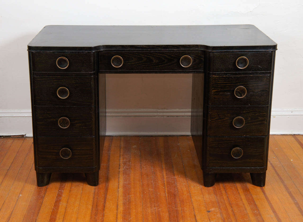 This is a great desk for an apartment.
Great Deco style to it.
Not too big, not too small. 
File drawers are perfect for those old fasioned paper important documents.
Finished all around so great for anywhere in the room.