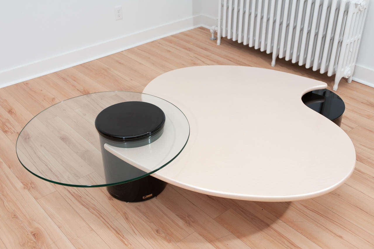 Organic form coffee table by Rougier, black and white lacquered wood with movable round glass top. signed.
