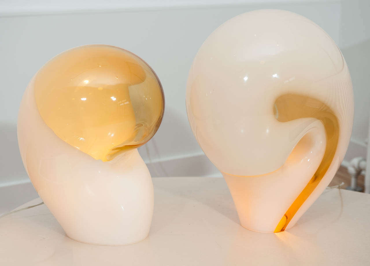 Unusual pair of organic form white and ochre translucent glass table lamps attributed to Vistosi. Two different dimensions: 
17''H X12''W X 14''D  and 16''H X 11''W X 12''D.