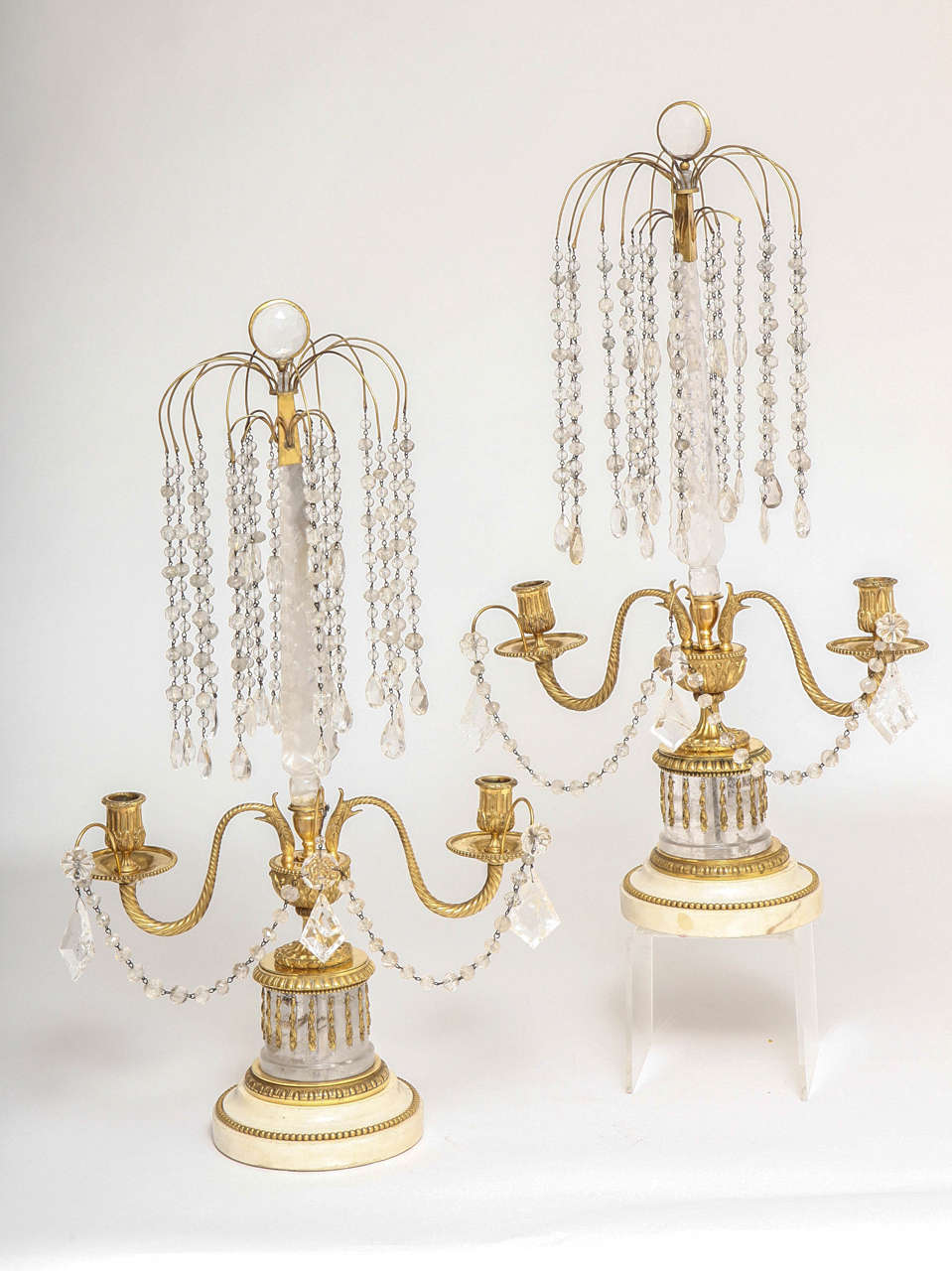 Pair of antique Russian rock crystal, doré bronze and white Carrara marble double light candelabrum in the form of a 