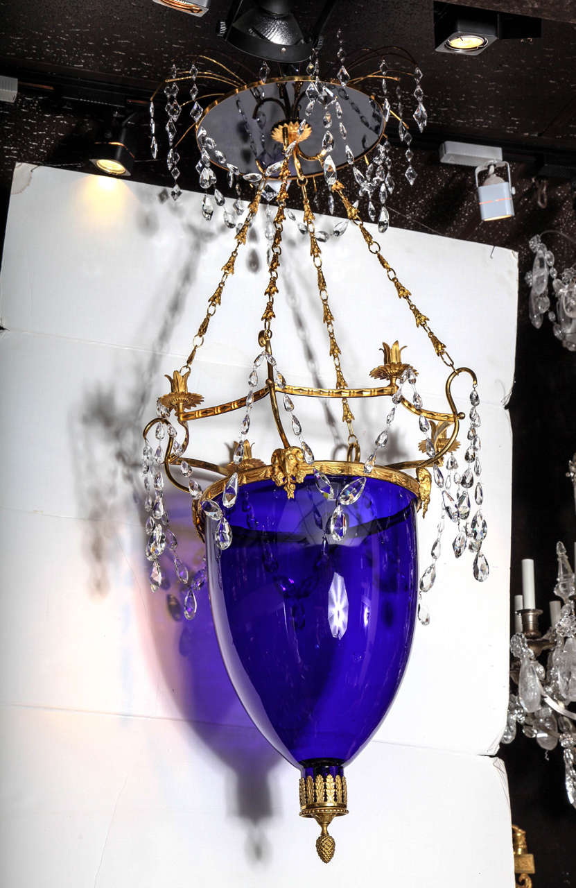 Russian neoclassical style cut-glass mounted gilt metal and cobalt blue glass four-light chandelier or lantern with the original canapé. It has cut-glass prisms and four candleholders.