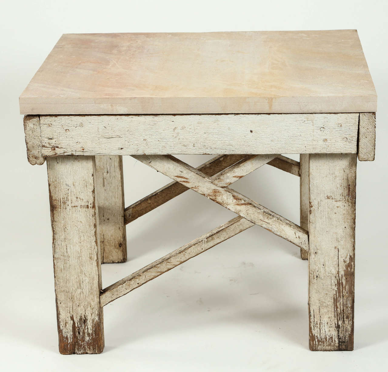 One of a kind architectural table, wooden base and 1.25 inch thick limestone table top.