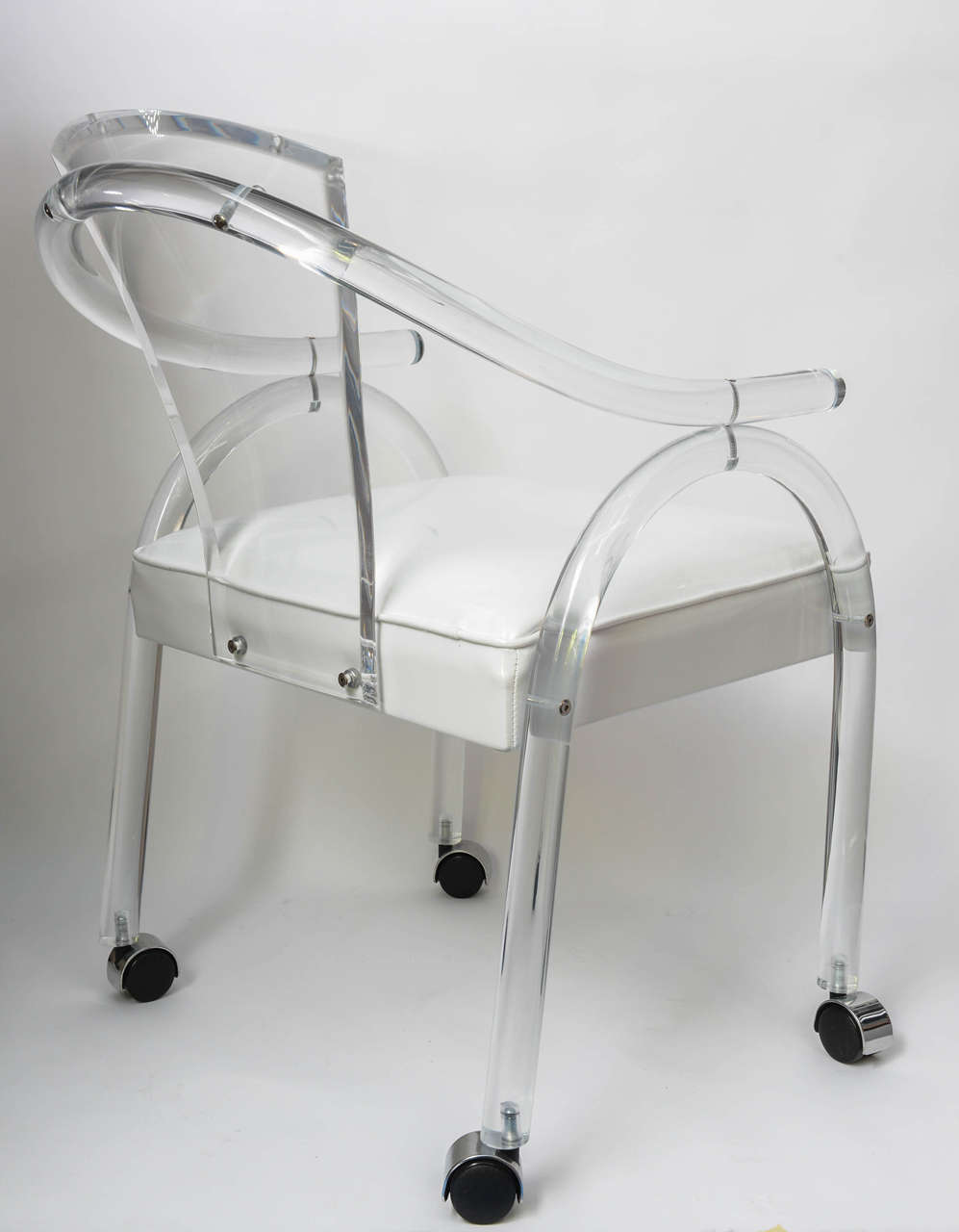 Acrylic 1970s Set of Four Lucite Rolling Chairs in the Style of Hollis Jones