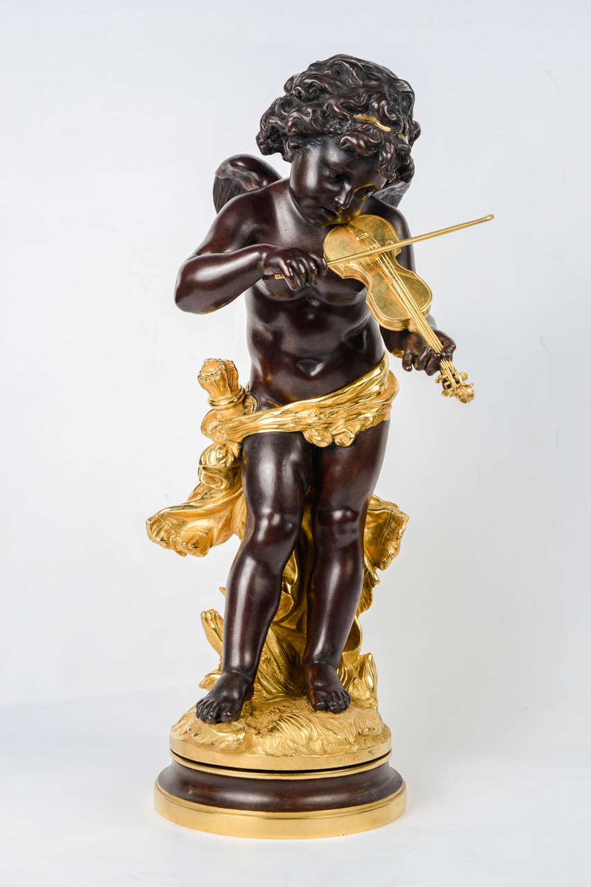 Double patina bronze statue, representing an angel playing violin
signed L. Grégoire..