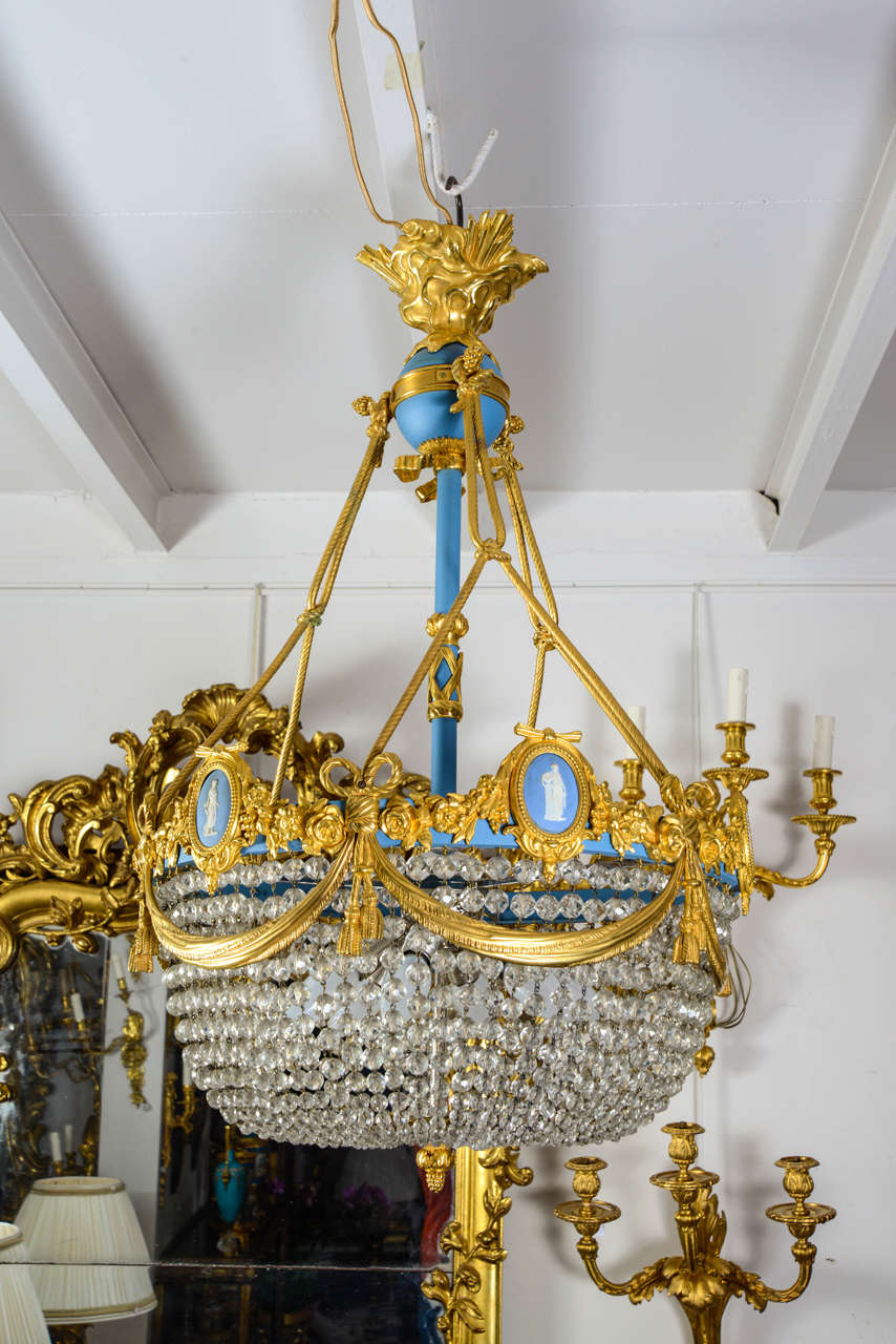 Bronze and crystal chandelier in shape of panel.
ornemented with wedgwood porcelain.