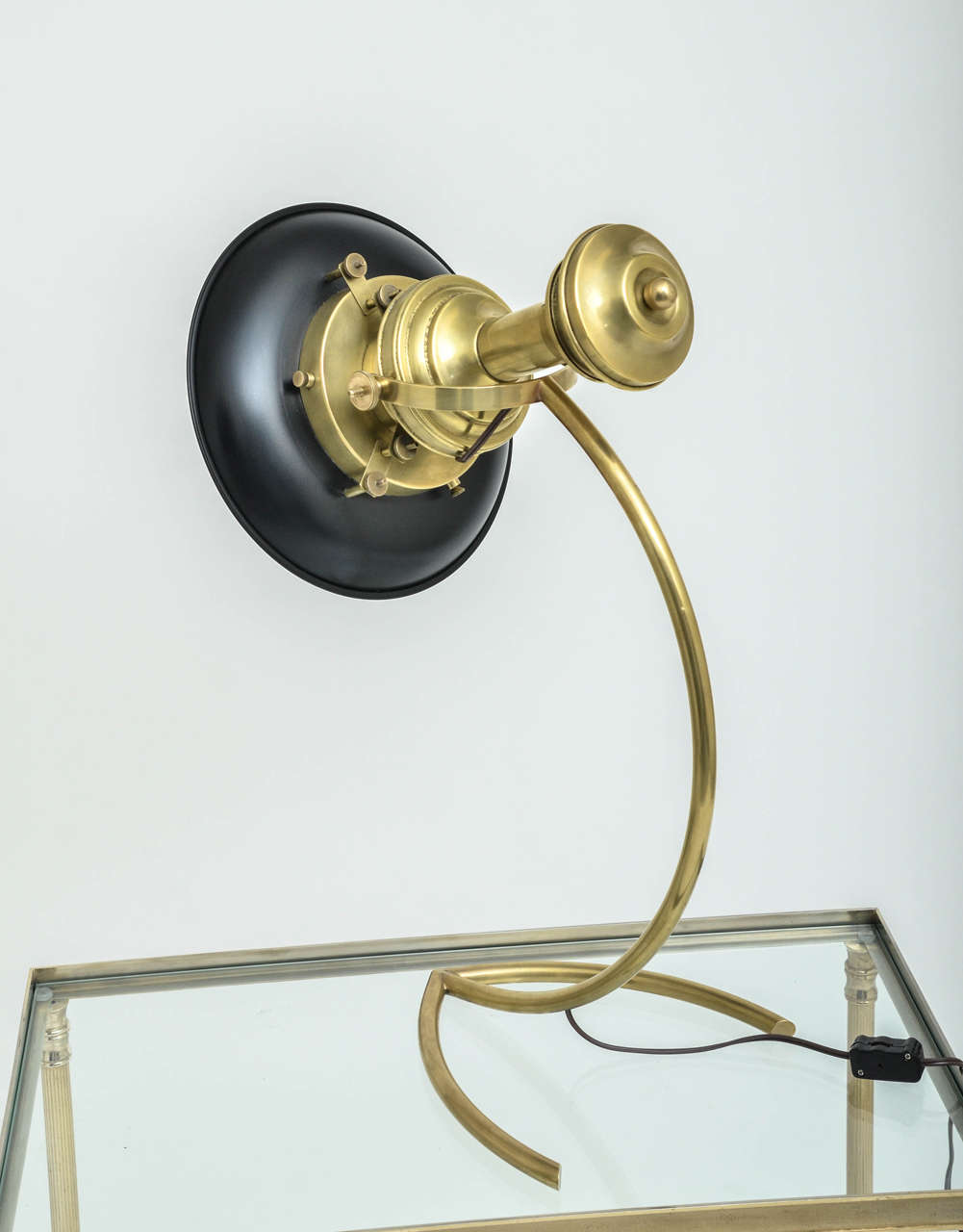 A 1940's French adjustable maritime brass lamp with black tole shade, adjustable and tilting.