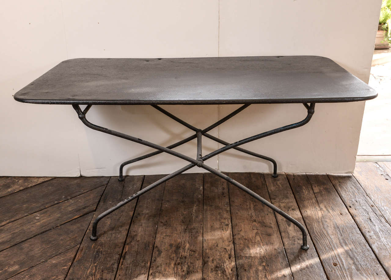 Simple French iron table from the 1920s, has had a clear coat added to protect from the elements. Nice simple lines.