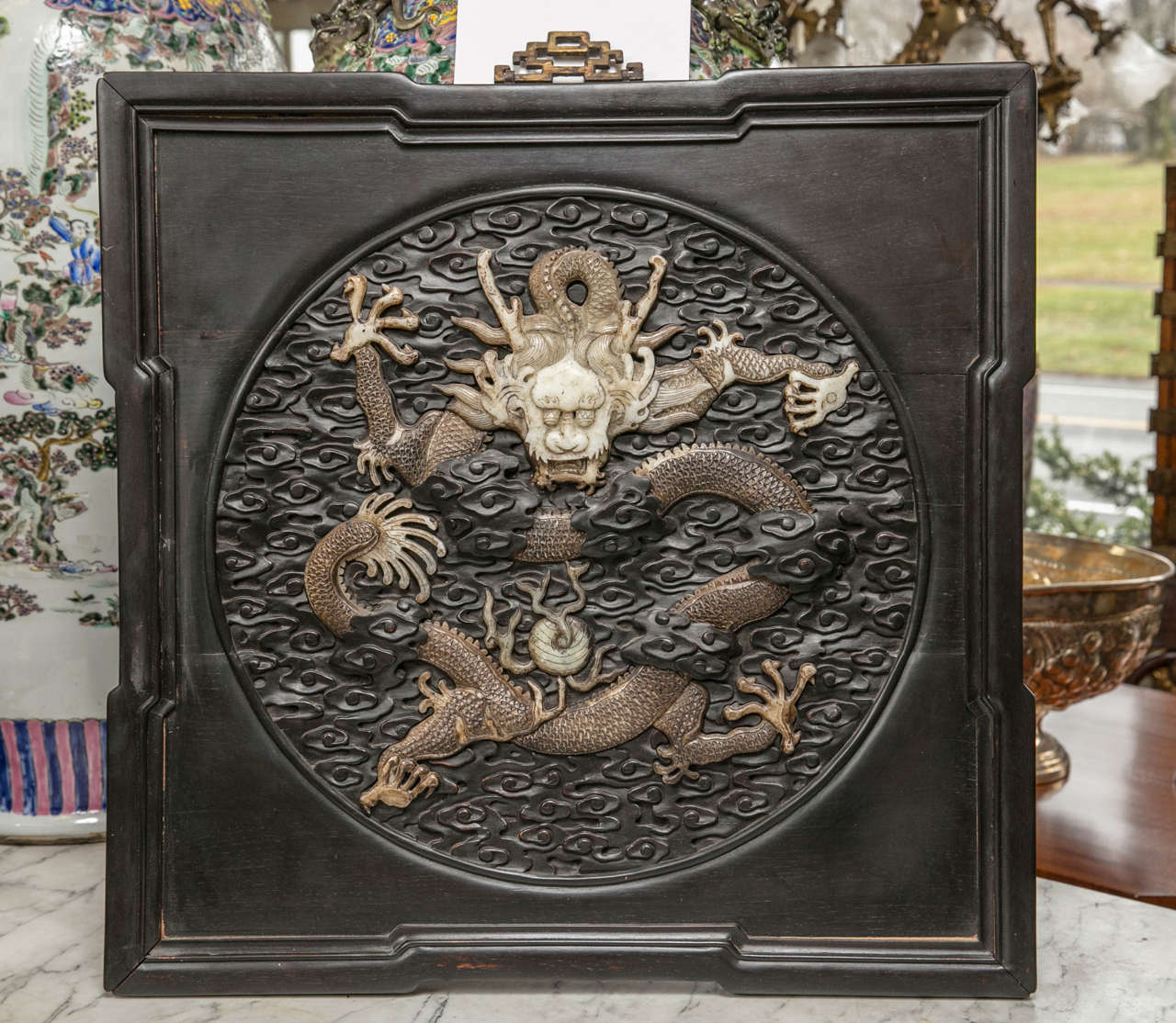 These plaques are self framed. The marble dragons of stained marble on a hand-carved background of hardwood.