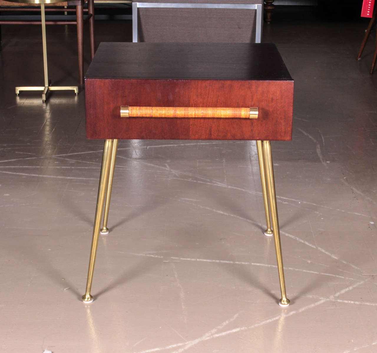 Single mahogany side table with brass legs and cane handles by T.H. Robsjohn-Gibbings for Widdicomb.