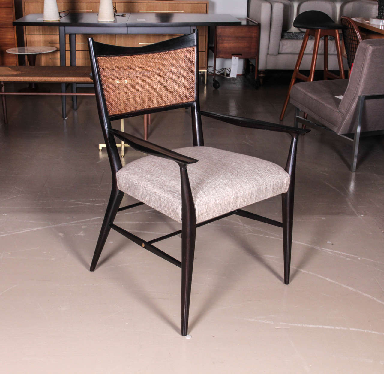 American Set of Six Ebonized Paul McCobb Dining Chairs with Caned Backs and Linen Seats