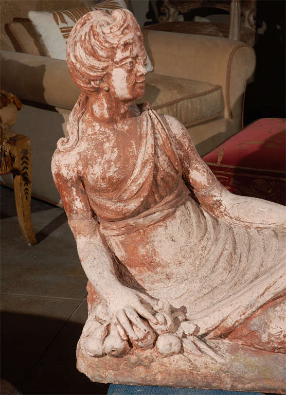 Beautifully patinated and gracefully scaled sculpture of a reclining woman.