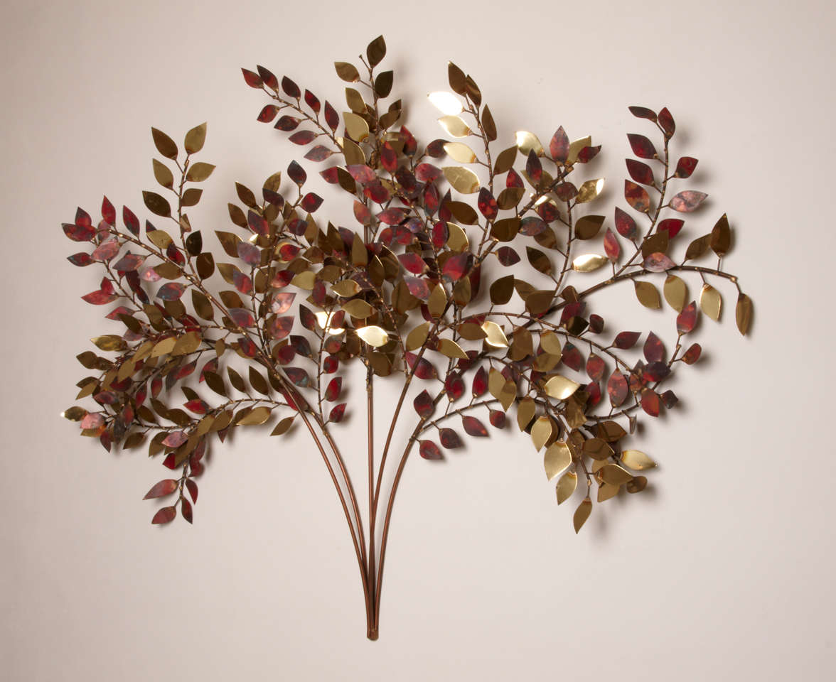 Gracious gilt and oxydated burnt rose patinated brass wall sculpture as a tree with five main branches and many leaves. 
Curtis Jere, association of Curtis Freiler and Jerry Fels.