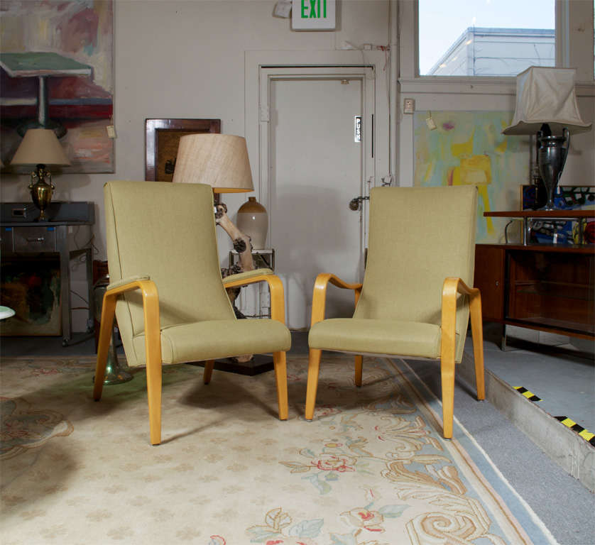 Pair of Thonet side chairs, with dramatic bentwood arms. One set of arms are swoop, and the other chair has padded arms. Both chairs have new upholstery, light olive in color. Perfect set of his and hers.
Smaller chair is 24w x 31.50d x 41h seating