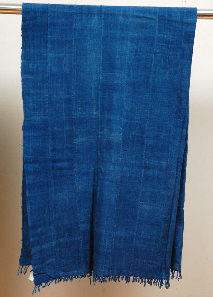 Natural indigo panels made up of narrow, backstrap loomed long strips sewn together. Made by Mossi tribal peoples in West Africa.  Priced individually at $395 each.  
3 SOLD
Second from right 67