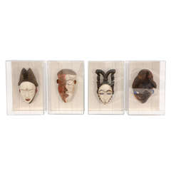 Two sets of African Masks in Lucite Frames