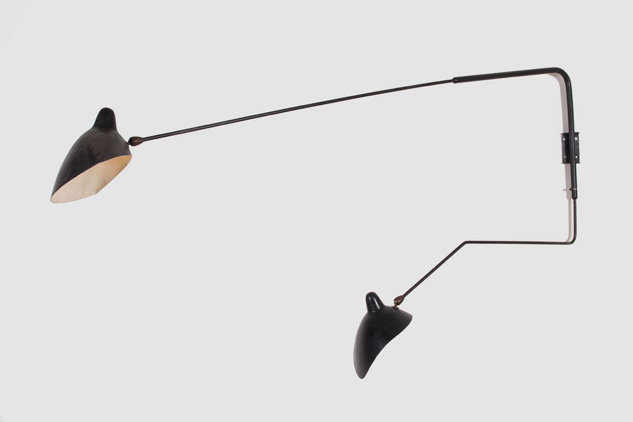Two-arm mobile wall light, lower arm is bent.

Original condition.
