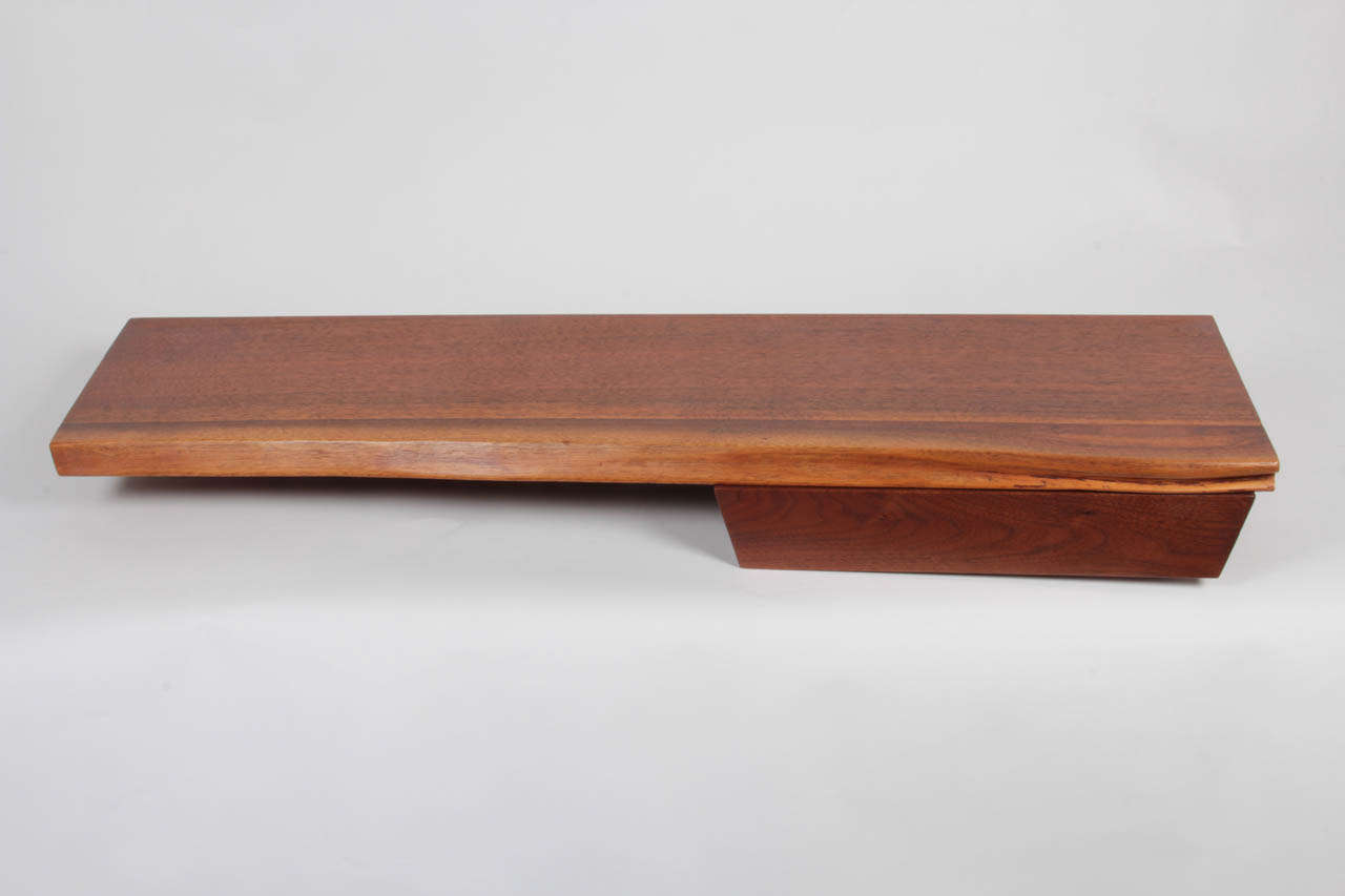 Wall-mounted Shelf with drawer in walnut, free-edge top.  Provenance available.
