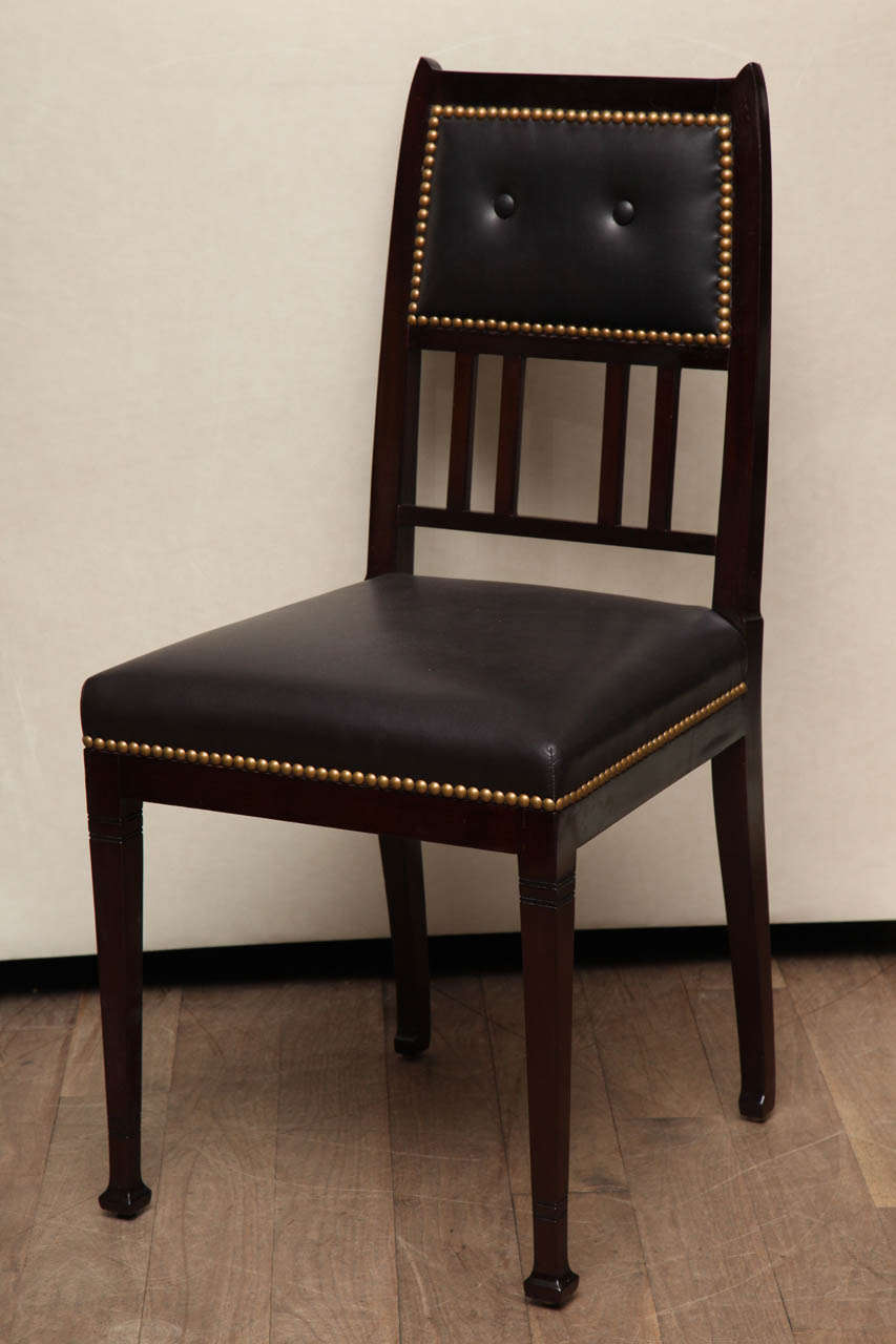 Mahogany Secessionist side chairs circa 1900 upholstered in goat leather with natural finish nailhead trim and updated tufting pattern - 3 chairs available.  Also a settee and a single armchair are available.