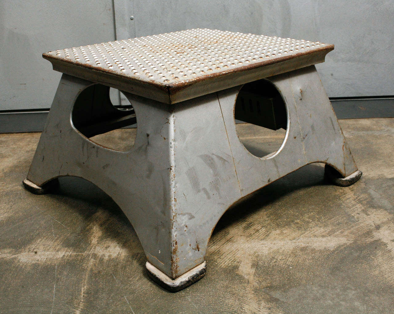 This American, Early 20th Century Pullman Passenger Train Step Stool was used for passengers to step up into the train. This step has a stamped metal top, four rubber feet and silver paint. These steps were of use from the 1920's up until the 1950's